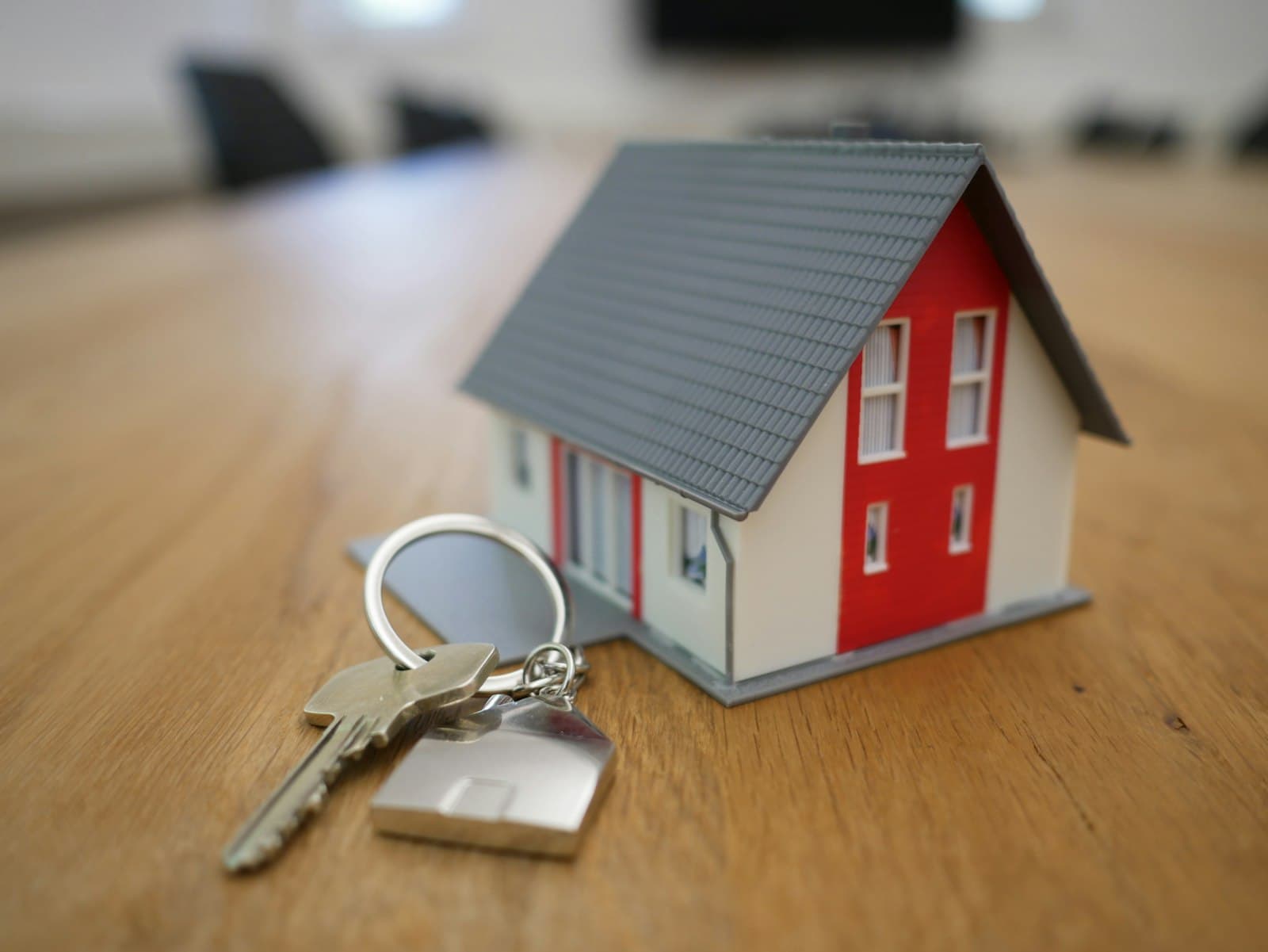 Realtor in blazer presenting a bright modern home interior, with a steady buyer-lead pipeline